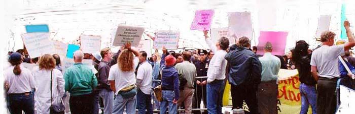 Picture of pope_protestors, with signs.